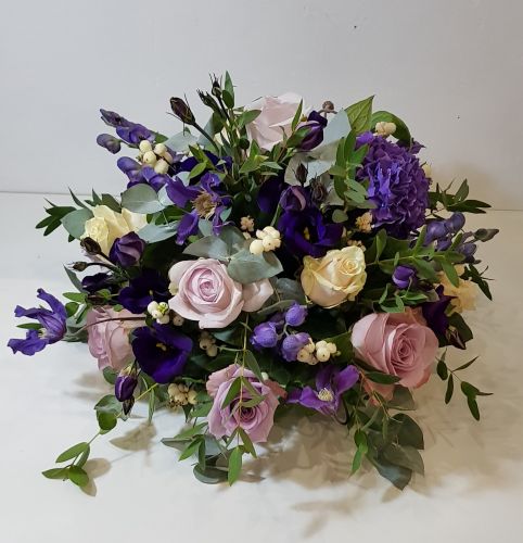PURPLE ROSE AND CLEMATIS TABLE ARRANGEMENT