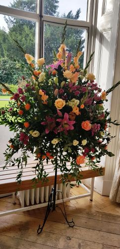 ROSE AND LILY PEDESTAL ARRANGEMENT